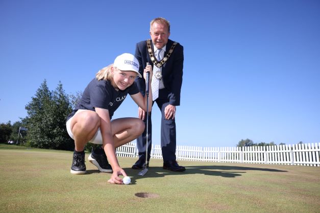 13-year-old-Gemma-McMeekin-who-plays-for-Ulster-Girls-and-is-on-the-Irish-U18-panel,-joins-Alderman-Stephen-Ross-at-the-ISPS-H.jpg